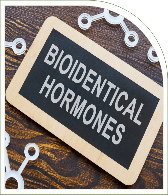 Wooden board with "Bioidentical Hormones" text surrounded by molecular structure models on a wooden surface.